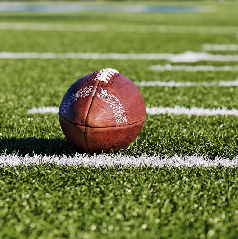 Football on green turf